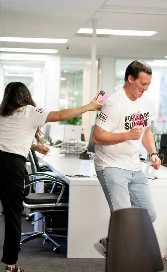 Two Clear Digital employees collaborating on a digital project in the office, reflecting our dynamic and inclusive workplace culture.