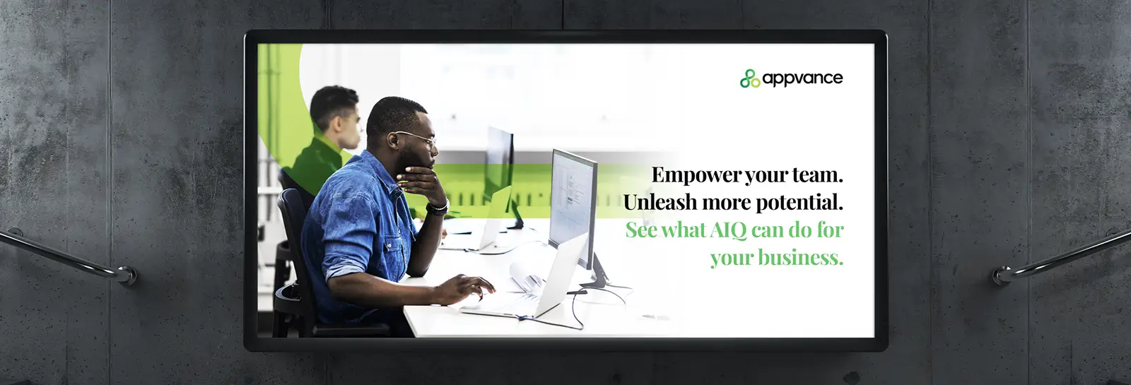 Business office billboard featuring Appvance branding and tagline 'Empower your team. Unleash more potential. See what AIQ can do for your business