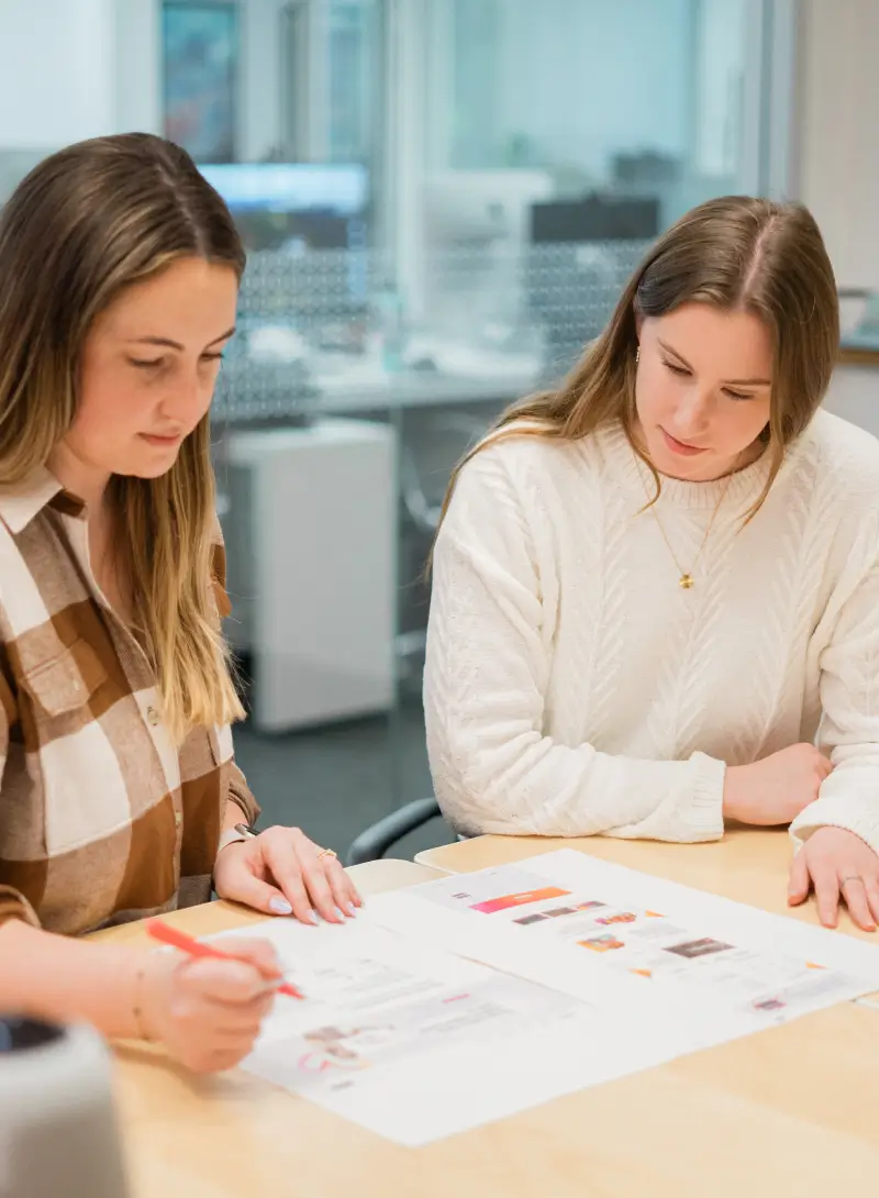 Team reviewing design documents together