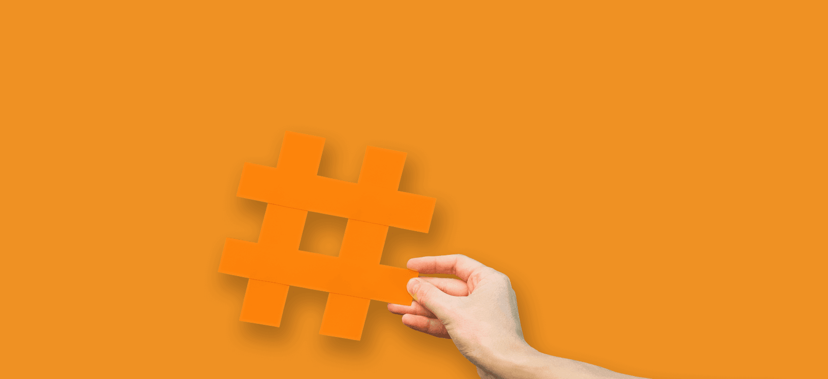 hand holding hashtag symbol representing social media marketing strategy for business growth
