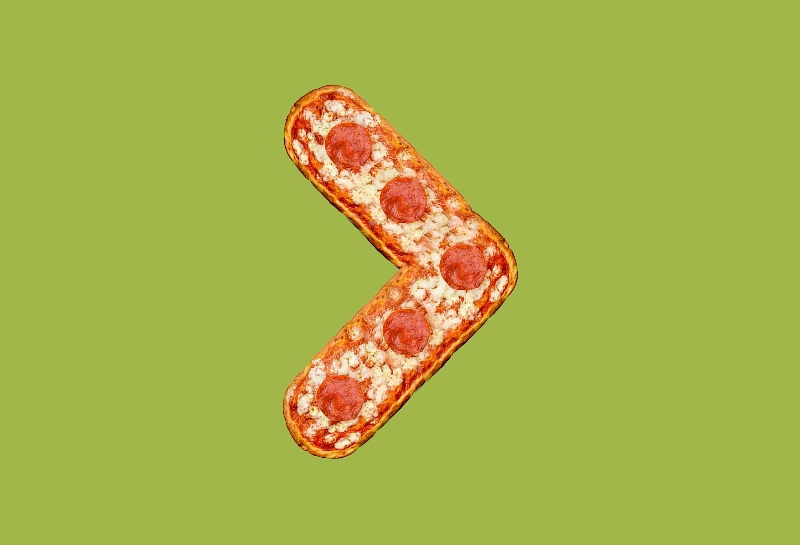 Creative food art showing an arrow made of pepperoni pizza